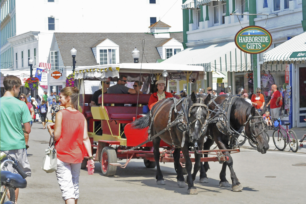 Mackinac Island People enjoying Mackinac Island - horse and carriage rides.